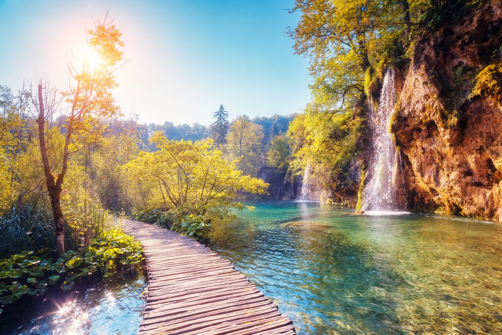 Majestic view on turquoise water and sunny beams in the Plitvice